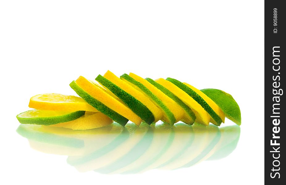 Sliced green and yellow limes shallow, isolated. Sliced green and yellow limes shallow, isolated