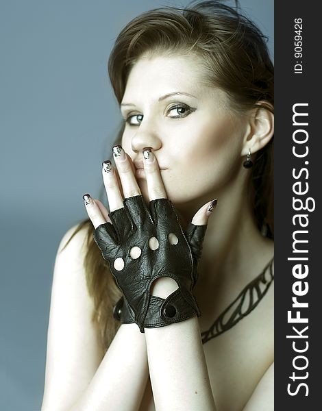 Portrait of girl is in leather gloves