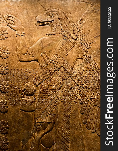 Relief from the palace of Ashurnasirpal II, king of Assyria from 883 to 859 BCE, The curation card notes: ...an eagle-headed demon engaged in a ritual to expel sickness and evil spirits from the house; the figure possibly had the function of purifying anyone entering the King&#x27;s Living Room. Los Angeles County Museum of Art &#x28;LACMA&#x29; in Los Angeles, California en.wikipedia.org/wiki/Ashurnasirpal_II