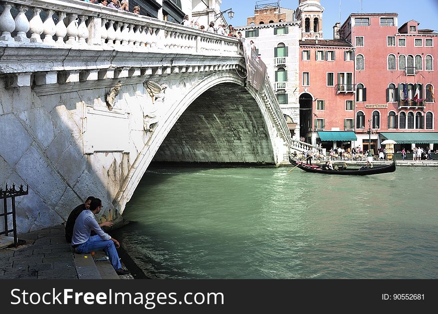 The water streets of Venice are canals which are navigated by gondolas and other small boats. During daylight hours the canals, bridges, and streets of Venice are full of tourists eager to experience the romance of this great travel destination. As night engulfs the town, tourists enjoy some fine dining at one of the many restaurants, leaving the waterways and streets quiet. The gondola is a traditional, flat-bottomed Venetian rowing boat, well suited to the conditions of the Venetian Lagoon. For centuries gondolas were once the chief means of transportation and most common watercraft within Venice. In modern times the iconic boats still have a role in public transport in the city, serving as ferries over the Grand Canal. They are also used in special regattas &#x28;rowing races&#x29; held amongst gondoliers. Their main role, however, is to carry tourists on rides throughout the canals. Gondolas are hand made using 8 different types of wood &#x28;fir, oak, cherry, walnut, elm, mahogany, larch and lime&#x29; and are composed of 280 pieces. The oars are made of beech wood. The left side of the gondola is longer than the right side. This asymmetry causes the gondola to resist the tendency to turn toward the left at the forward stroke. The water streets of Venice are canals which are navigated by gondolas and other small boats. During daylight hours the canals, bridges, and streets of Venice are full of tourists eager to experience the romance of this great travel destination. As night engulfs the town, tourists enjoy some fine dining at one of the many restaurants, leaving the waterways and streets quiet. The gondola is a traditional, flat-bottomed Venetian rowing boat, well suited to the conditions of the Venetian Lagoon. For centuries gondolas were once the chief means of transportation and most common watercraft within Venice. In modern times the iconic boats still have a role in public transport in the city, serving as ferries over the Grand Canal. They are also used in special regattas &#x28;rowing races&#x29; held amongst gondoliers. Their main role, however, is to carry tourists on rides throughout the canals. Gondolas are hand made using 8 different types of wood &#x28;fir, oak, cherry, walnut, elm, mahogany, larch and lime&#x29; and are composed of 280 pieces. The oars are made of beech wood. The left side of the gondola is longer than the right side. This asymmetry causes the gondola to resist the tendency to turn toward the left at the forward stroke.