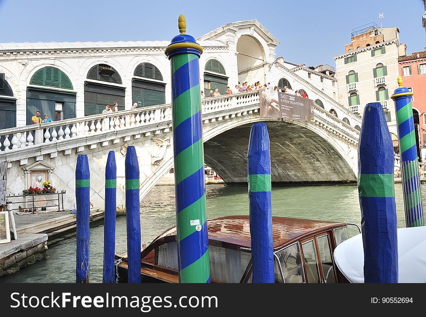 The water streets of Venice are canals which are navigated by gondolas and other small boats. During daylight hours the canals, bridges, and streets of Venice are full of tourists eager to experience the romance of this great travel destination. As night engulfs the town, tourists enjoy some fine dining at one of the many restaurants, leaving the waterways and streets quiet. The gondola is a traditional, flat-bottomed Venetian rowing boat, well suited to the conditions of the Venetian Lagoon. For centuries gondolas were once the chief means of transportation and most common watercraft within Venice. In modern times the iconic boats still have a role in public transport in the city, serving as ferries over the Grand Canal. They are also used in special regattas &#x28;rowing races&#x29; held amongst gondoliers. Their main role, however, is to carry tourists on rides throughout the canals. Gondolas are hand made using 8 different types of wood &#x28;fir, oak, cherry, walnut, elm, mahogany, larch and lime&#x29; and are composed of 280 pieces. The oars are made of beech wood. The left side of the gondola is longer than the right side. This asymmetry causes the gondola to resist the tendency to turn toward the left at the forward stroke. The water streets of Venice are canals which are navigated by gondolas and other small boats. During daylight hours the canals, bridges, and streets of Venice are full of tourists eager to experience the romance of this great travel destination. As night engulfs the town, tourists enjoy some fine dining at one of the many restaurants, leaving the waterways and streets quiet. The gondola is a traditional, flat-bottomed Venetian rowing boat, well suited to the conditions of the Venetian Lagoon. For centuries gondolas were once the chief means of transportation and most common watercraft within Venice. In modern times the iconic boats still have a role in public transport in the city, serving as ferries over the Grand Canal. They are also used in special regattas &#x28;rowing races&#x29; held amongst gondoliers. Their main role, however, is to carry tourists on rides throughout the canals. Gondolas are hand made using 8 different types of wood &#x28;fir, oak, cherry, walnut, elm, mahogany, larch and lime&#x29; and are composed of 280 pieces. The oars are made of beech wood. The left side of the gondola is longer than the right side. This asymmetry causes the gondola to resist the tendency to turn toward the left at the forward stroke.