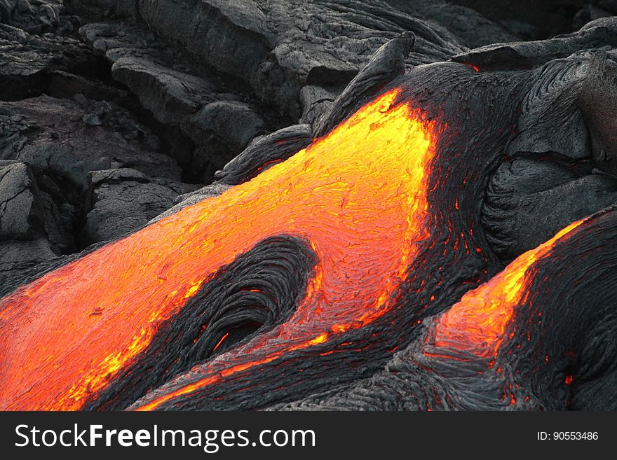 A molten lava flow coming down a mountain.