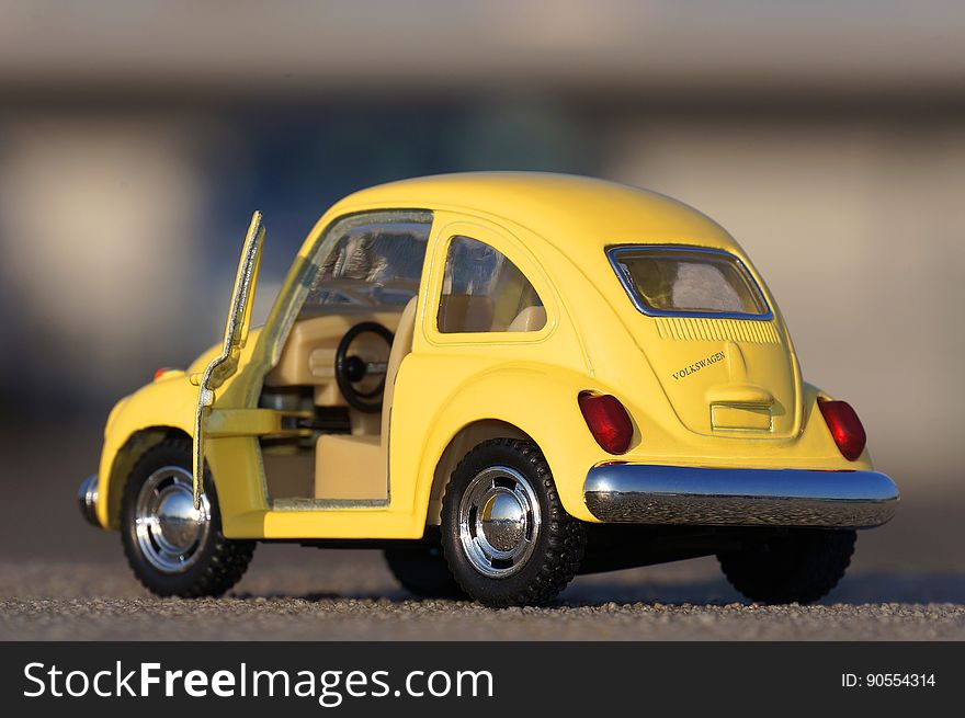 A miniature VW Beetle with the door open. A miniature VW Beetle with the door open.