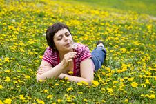 Young Woman Lying In A Meadow Stock Images