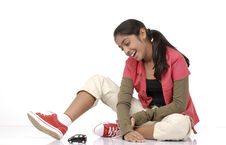 Girl Looking At Toy Car Stock Photography Girl Looking At Toy Car Stock Photography