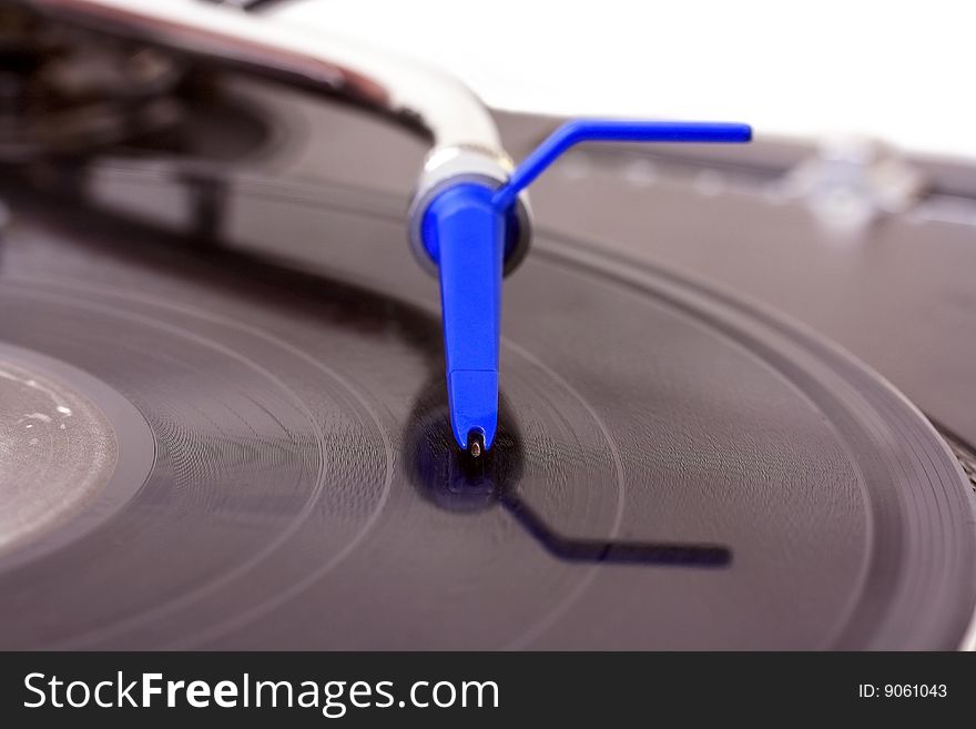 Dj needle on turntable isolated on white