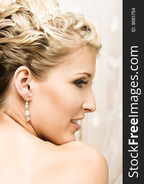 Beautiful Blond bride wearing diamond jewelery and tiara. Beautiful Blond bride wearing diamond jewelery and tiara