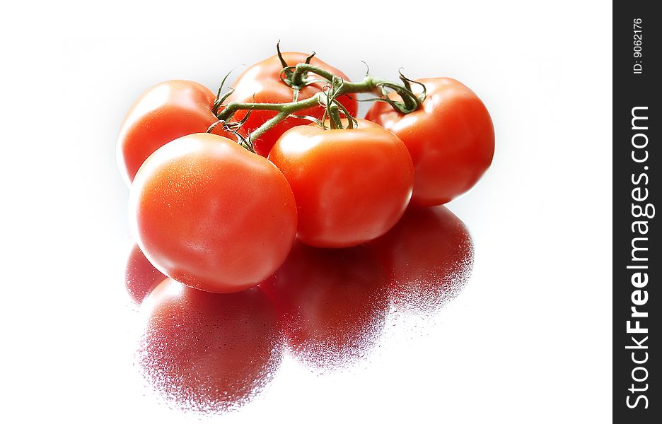 A bunch of tomatoes isolated over white background