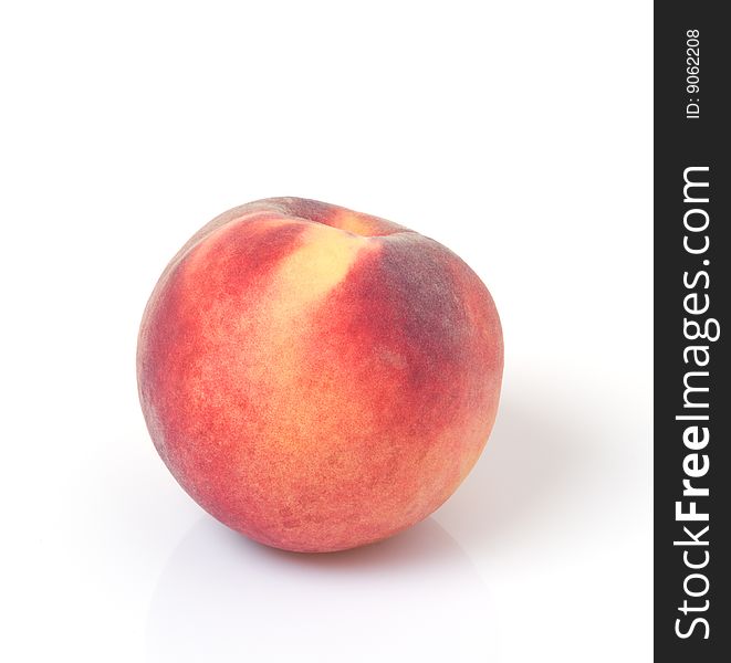 Ripe, sweet peach with colors red, orange, and yellow. Ripe, sweet peach with colors red, orange, and yellow