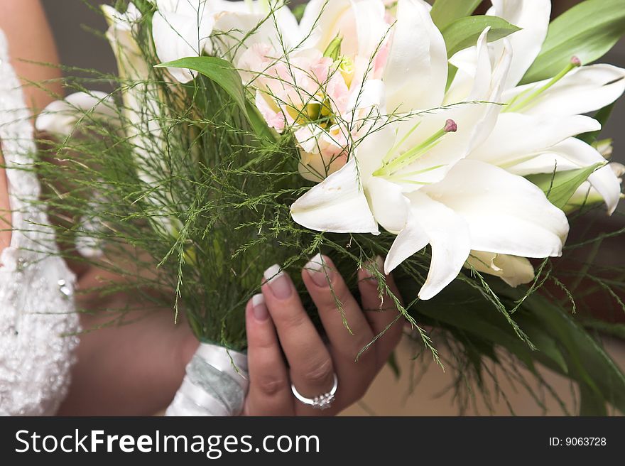 Bride holding a floral bouquet on her wedding day