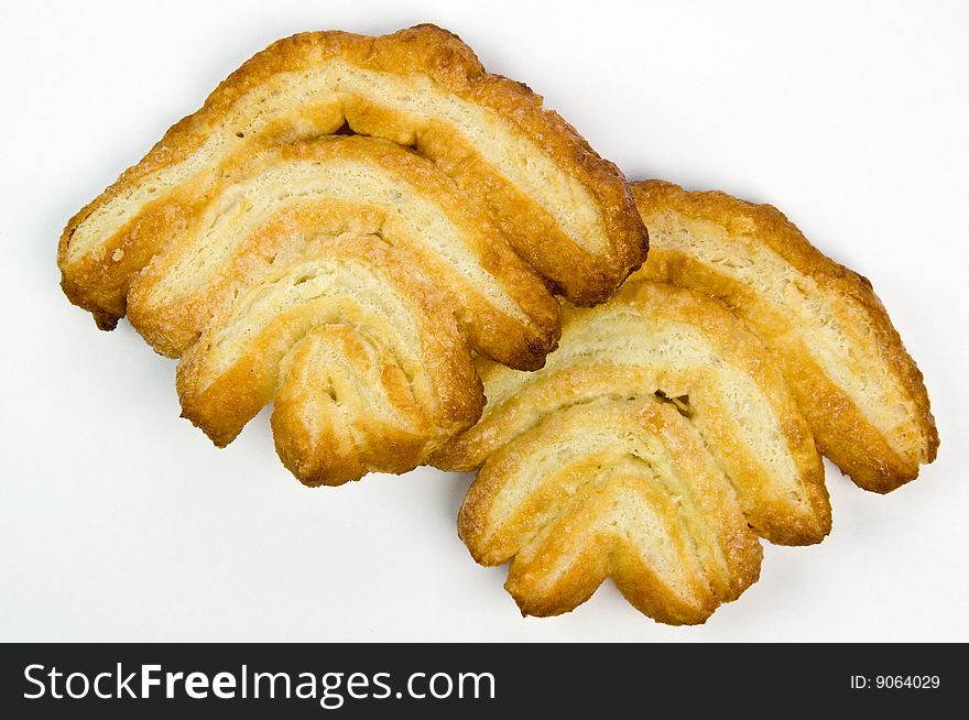 Crispy puffed pastry cookies - isolated on white