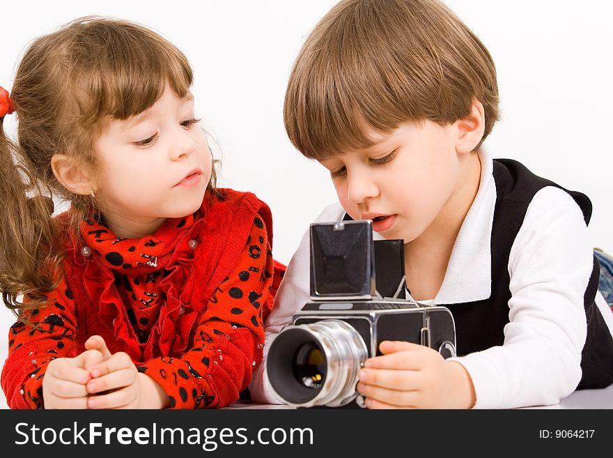 Adorable children taking pictures with photo camera. Adorable children taking pictures with photo camera