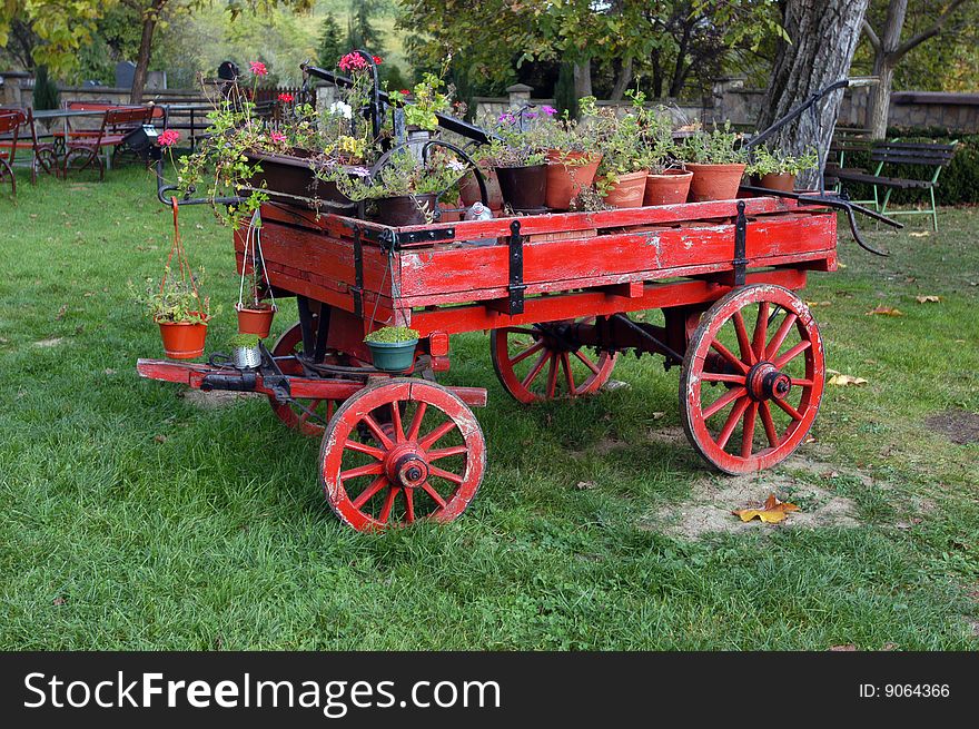 Old horse drawn wagon filled with flowers