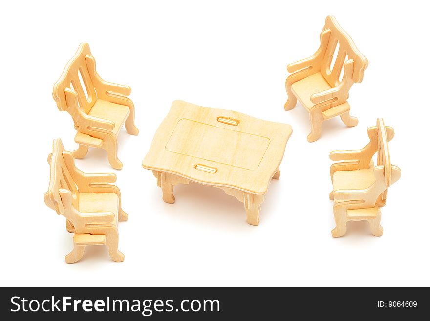 Wooden toy furniture on a white background