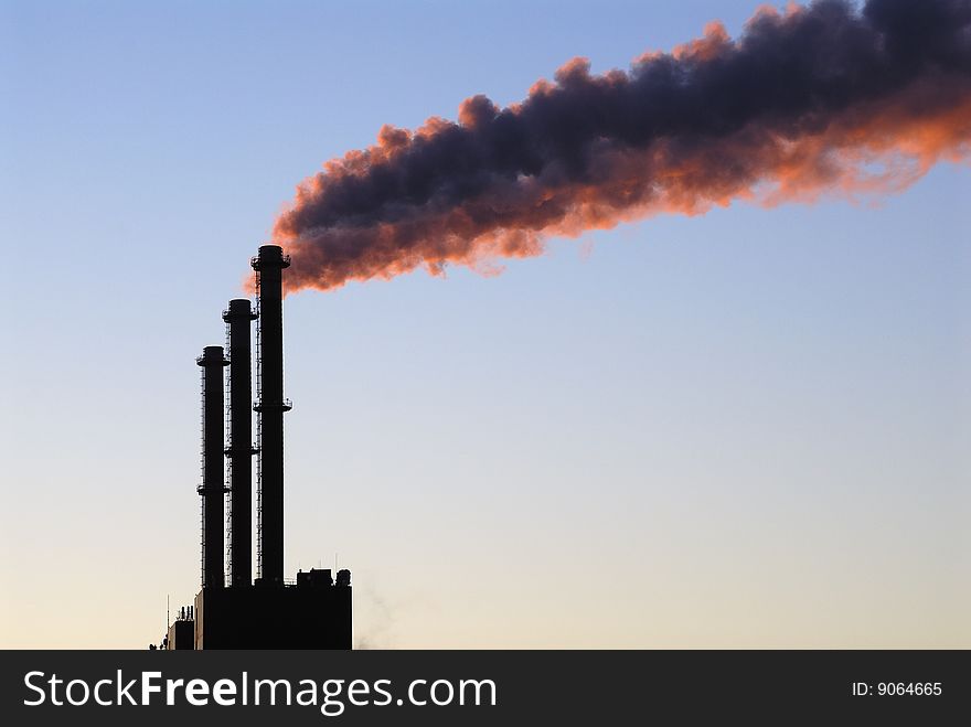 Steaming chimneys of a power plant