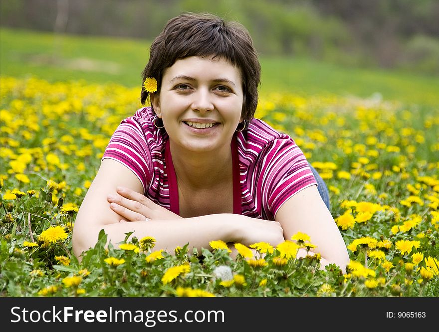 Young Woman Lying In A Meadow