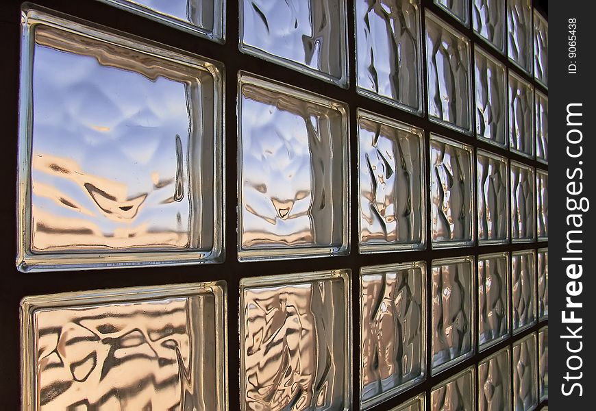 Wall made of glass bricks distorting light. Wall made of glass bricks distorting light