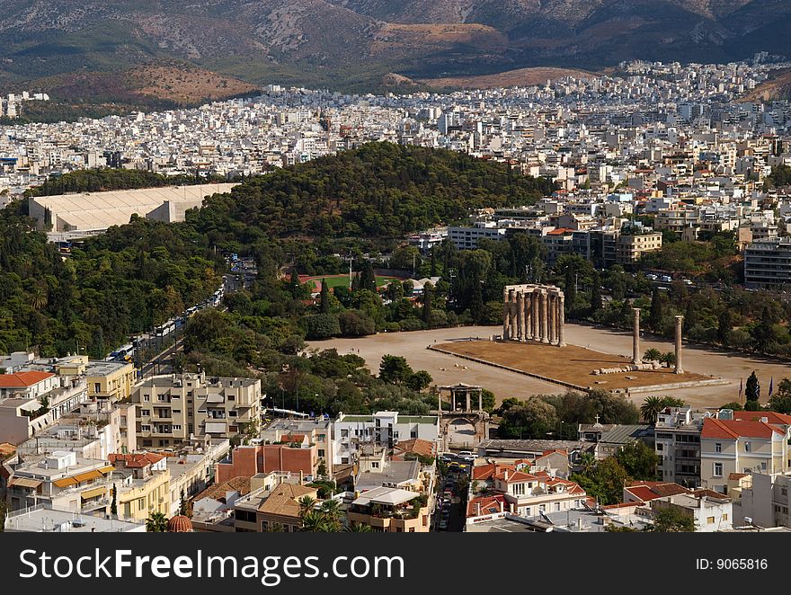 The Temple of Olympian Zeus, surrounded by the urban sprawl of modern Athens, Greece. The Temple of Olympian Zeus, surrounded by the urban sprawl of modern Athens, Greece