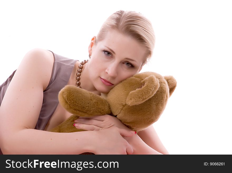 Woman with a toy bear on a white background. Woman with a toy bear on a white background