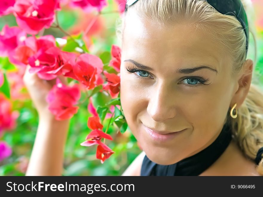 Close-up outdoor shot of a model with flowers. Close-up outdoor shot of a model with flowers