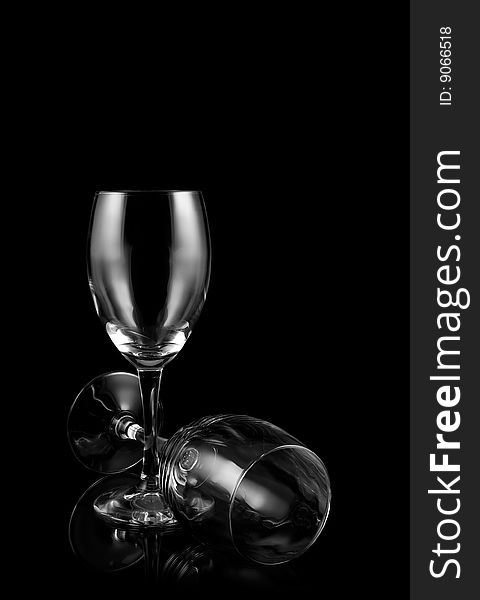 Two wineglasses on black background