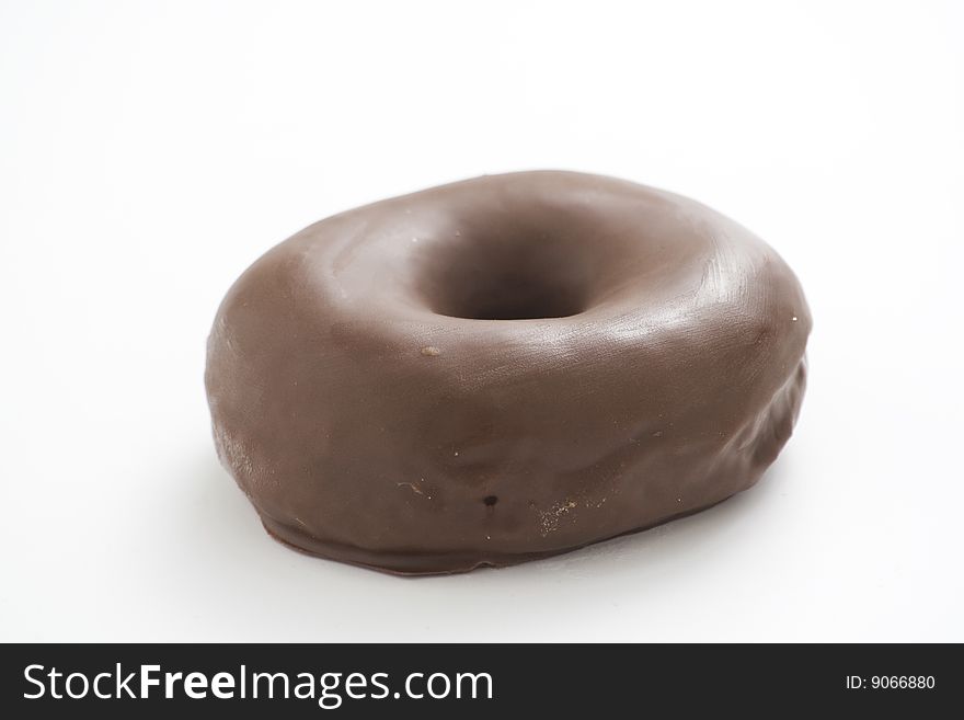 Breakfast glass of chocolate milk and donut isolated