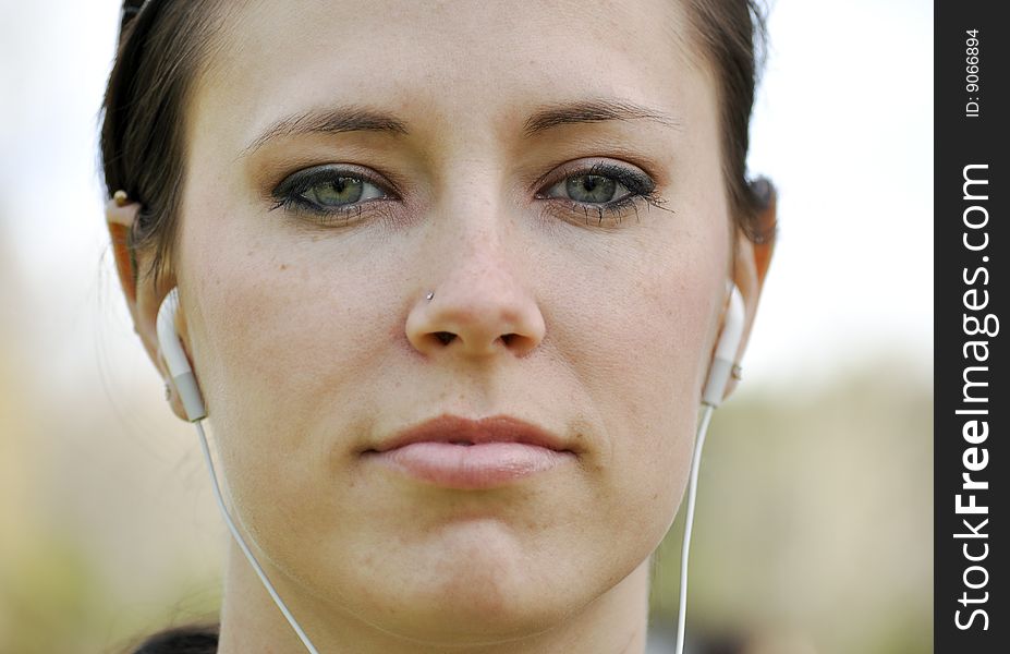 Young woman wearing ear phones. Young woman wearing ear phones