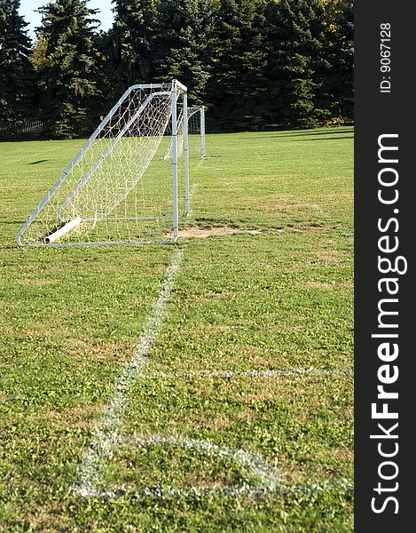 Soccer on baseline of soccer field with painted line. Soccer on baseline of soccer field with painted line