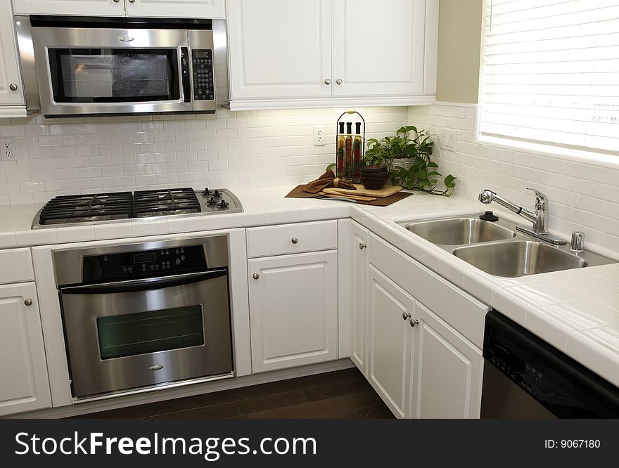 Modern designer kitchen with stainless steel appliances. Modern designer kitchen with stainless steel appliances.