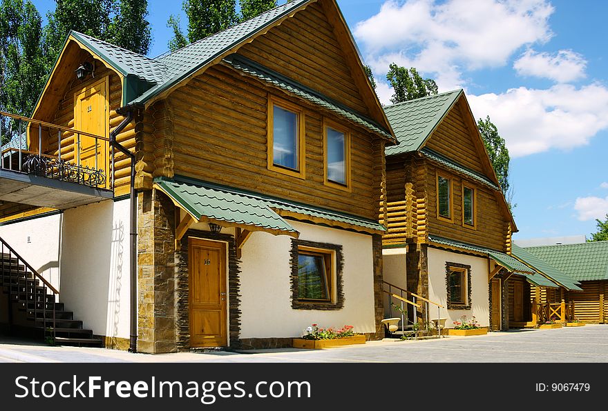 Settling of the two-story huts, with reflection sky in window