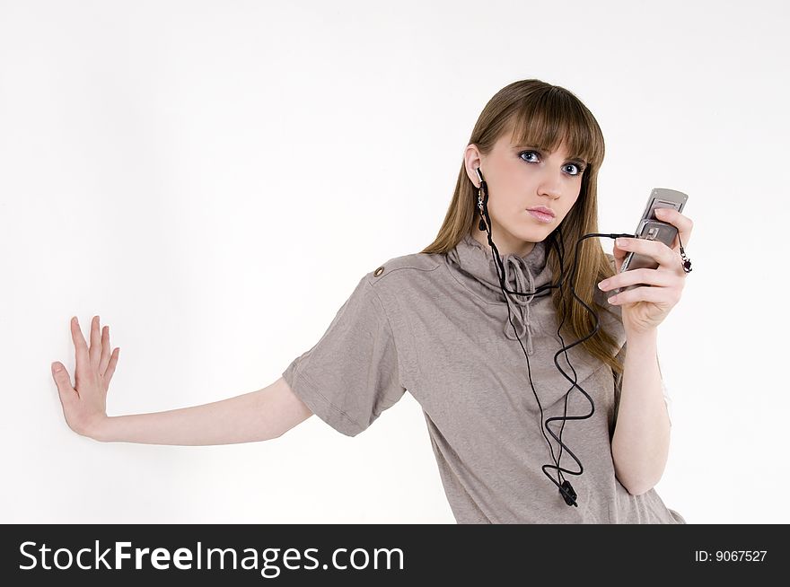 Female model with cellphone and headphones