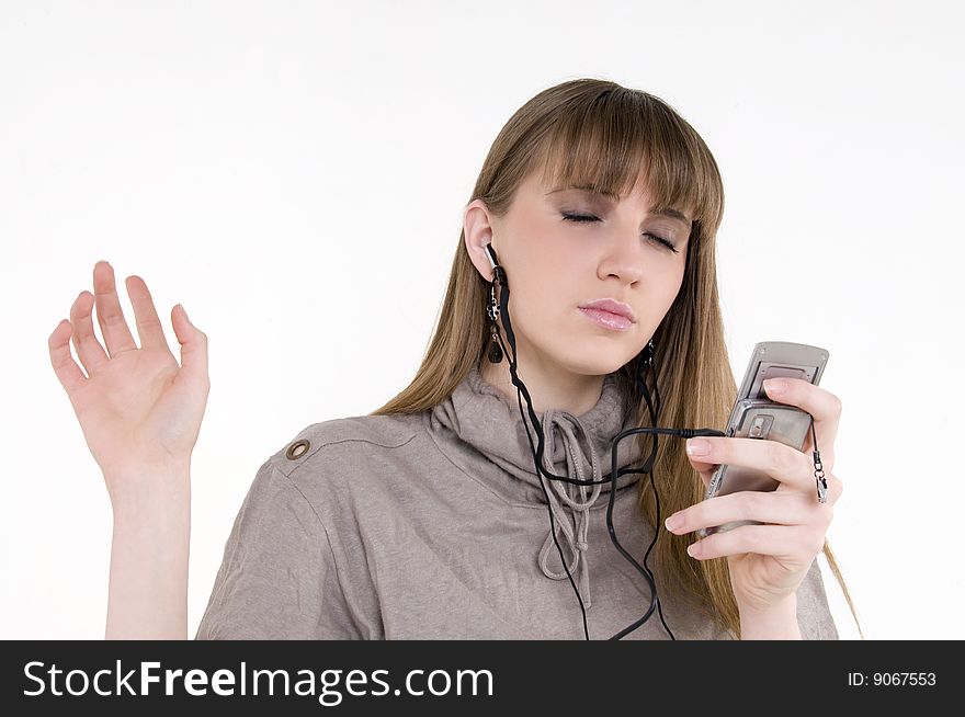 Female model with cellphone and headphones