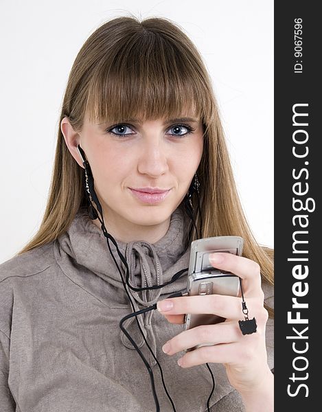 Female Model With Cellphone And Headphones