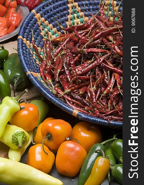 Various Chili Peppers layed out in a studio