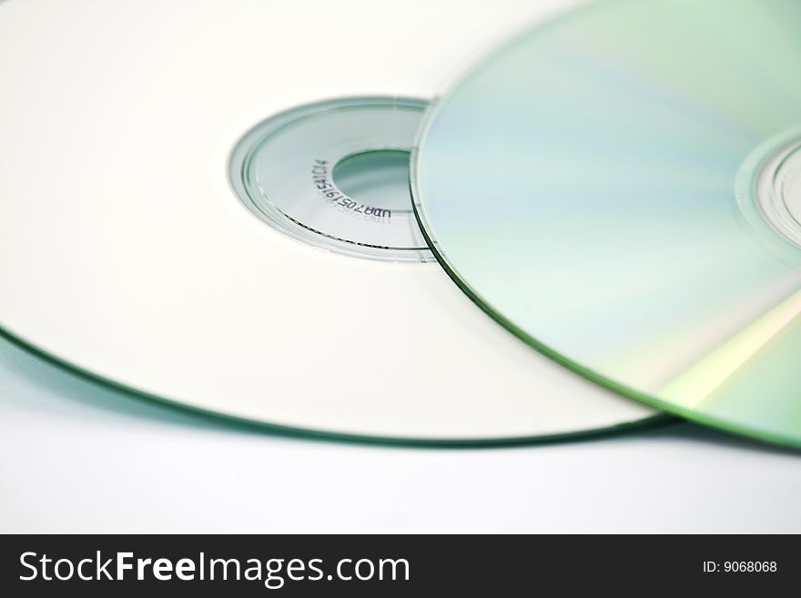 Two CDs, one on top of another, one up-side down, isolated over white. Two CDs, one on top of another, one up-side down, isolated over white