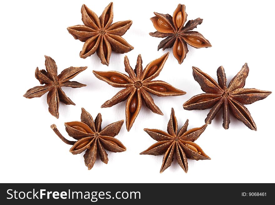 Still life of cinnamon and star anise on white