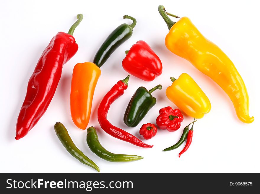 Several different peppers on white background. Several different peppers on white background