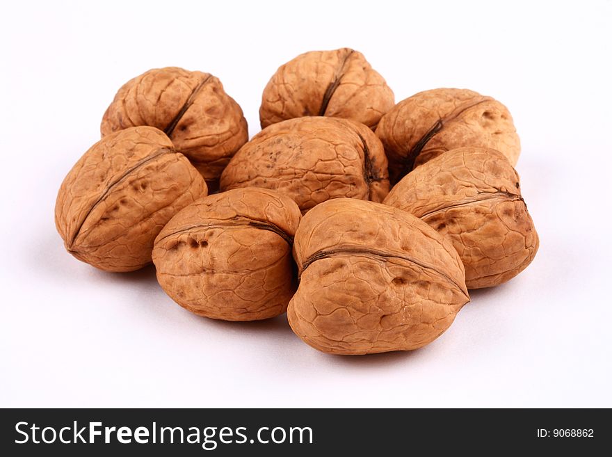 A group of walnuts on white background