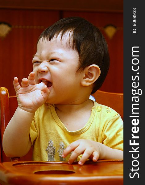 Kid laughing and biting fingers. Kid laughing and biting fingers