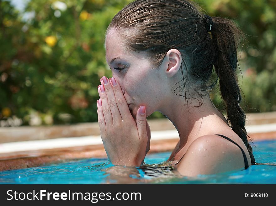 Young Woman In The Swimming Pool