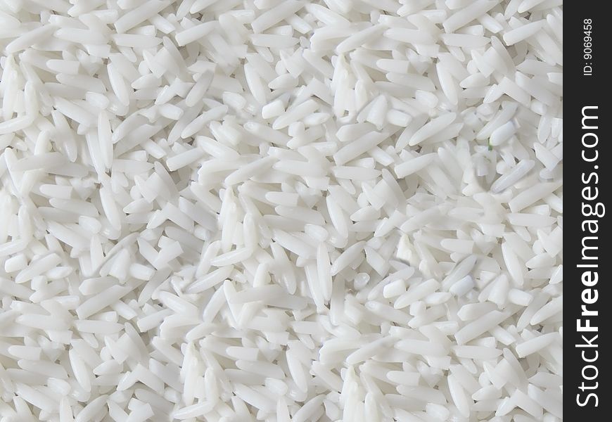 White rice granules texture background. White rice granules texture background