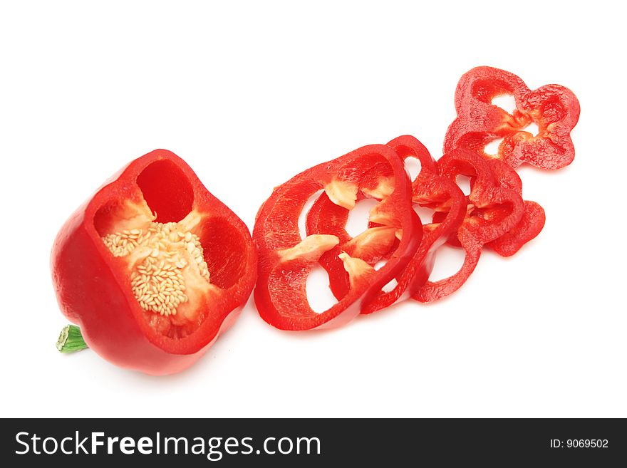 Sliced red sweet pepper isolated on white. Sliced red sweet pepper isolated on white.