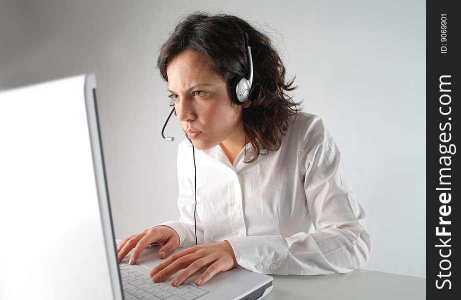 Customer support operator using laptop