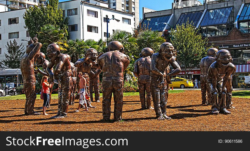 A-maze-ing Laughter was designed by Yue Minjun and installed in Morton Park along the English Bay in West End, Vancouver in 2009. The patinated bronze sculpture portrays the artist&#x27;s own image &#x22;in a state of hysterical laughter&#x22;. It was created as part of the Vancouver International Sculpture Biennale, which exhibits international contemporary works in public spaces. The sculpture was donated to the City of Vancouver by Chip and Shannon Wilson through the Wilson Foundation on August 11, 2012. A-maze-ing Laughter was designed by Yue Minjun and installed in Morton Park along the English Bay in West End, Vancouver in 2009. The patinated bronze sculpture portrays the artist&#x27;s own image &#x22;in a state of hysterical laughter&#x22;. It was created as part of the Vancouver International Sculpture Biennale, which exhibits international contemporary works in public spaces. The sculpture was donated to the City of Vancouver by Chip and Shannon Wilson through the Wilson Foundation on August 11, 2012