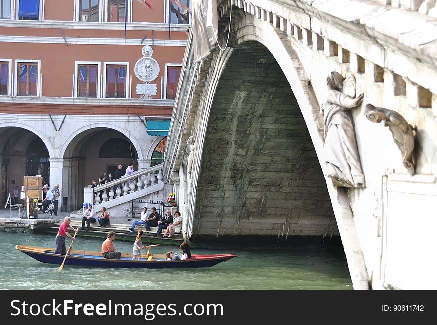 The water streets of Venice are canals which are navigated by gondolas and other small boats. During daylight hours the canals, bridges, and streets of Venice are full of tourists eager to experience the romance of this great travel destination. As night engulfs the town, tourists enjoy some fine dining at one of the many restaurants, leaving the waterways and streets quiet. The gondola is a traditional, flat-bottomed Venetian rowing boat, well suited to the conditions of the Venetian Lagoon. For centuries gondolas were once the chief means of transportation and most common watercraft within Venice. In modern times the iconic boats still have a role in public transport in the city, serving as ferries over the Grand Canal. They are also used in special regattas &#x28;rowing races&#x29; held amongst gondoliers. Their main role, however, is to carry tourists on rides throughout the canals. Gondolas are hand made using 8 different types of wood &#x28;fir, oak, cherry, walnut, elm, mahogany, larch and lime&#x29; and are composed of 280 pieces. The oars are made of beech wood. The left side of the gondola is longer than the right side. This asymmetry causes the gondola to resist the tendency to turn toward the left at the forward stroke. The water streets of Venice are canals which are navigated by gondolas and other small boats. During daylight hours the canals, bridges, and streets of Venice are full of tourists eager to experience the romance of this great travel destination. As night engulfs the town, tourists enjoy some fine dining at one of the many restaurants, leaving the waterways and streets quiet. The gondola is a traditional, flat-bottomed Venetian rowing boat, well suited to the conditions of the Venetian Lagoon. For centuries gondolas were once the chief means of transportation and most common watercraft within Venice. In modern times the iconic boats still have a role in public transport in the city, serving as ferries over the Grand Canal. They are also used in special regattas &#x28;rowing races&#x29; held amongst gondoliers. Their main role, however, is to carry tourists on rides throughout the canals. Gondolas are hand made using 8 different types of wood &#x28;fir, oak, cherry, walnut, elm, mahogany, larch and lime&#x29; and are composed of 280 pieces. The oars are made of beech wood. The left side of the gondola is longer than the right side. This asymmetry causes the gondola to resist the tendency to turn toward the left at the forward stroke.