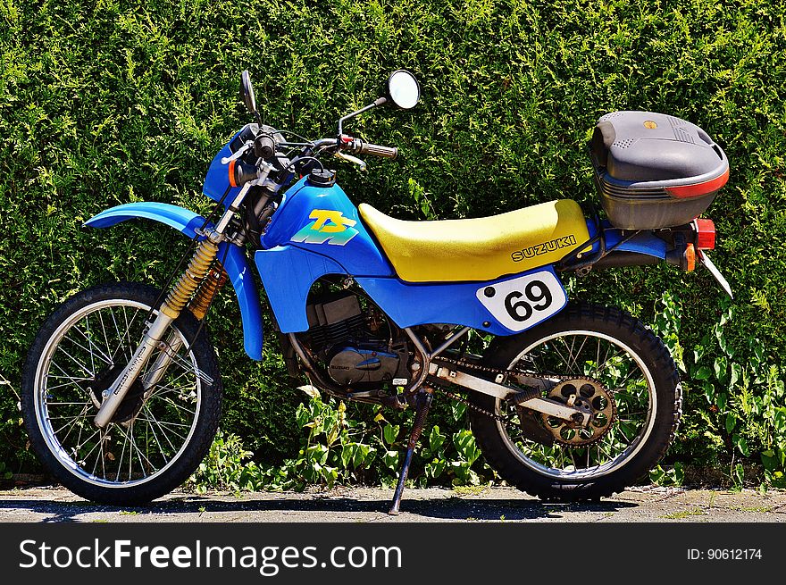 Blue And Yellow Suzuki Ts