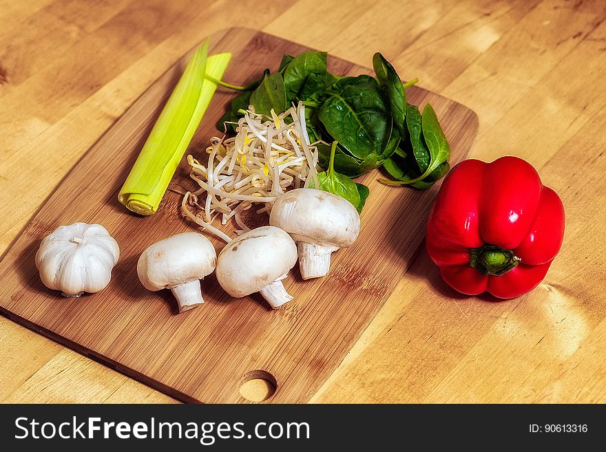 Cutting Board With Mushrooms And Vegetables