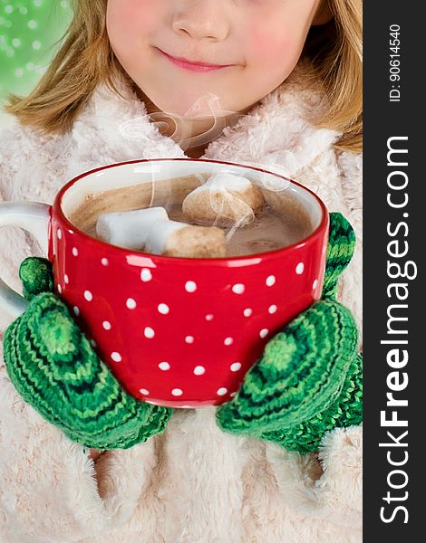 Girl In White Snow Coat Holding Red And White Ceramic Mug