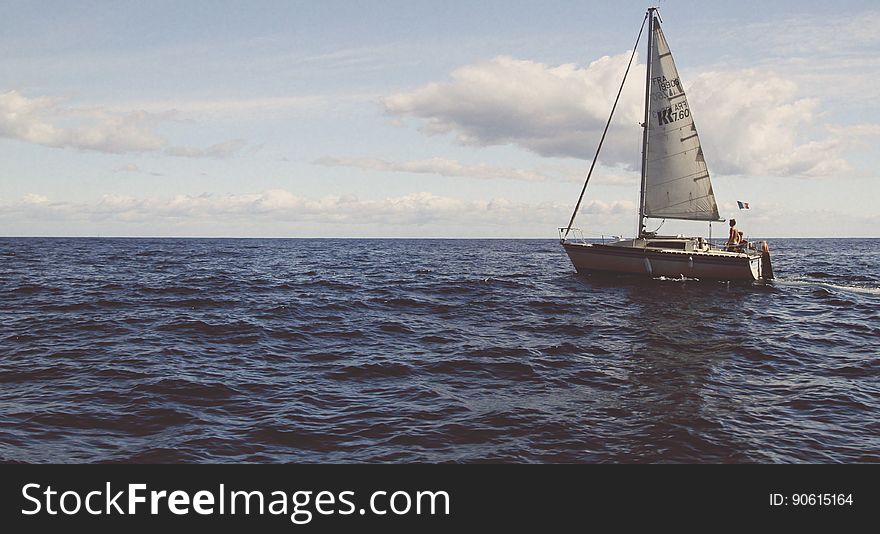 Scenic view of yacht sailing in the Mediterranean sea, cloudscape background.