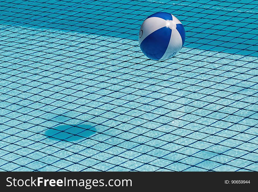 Beach ball floating in the pool